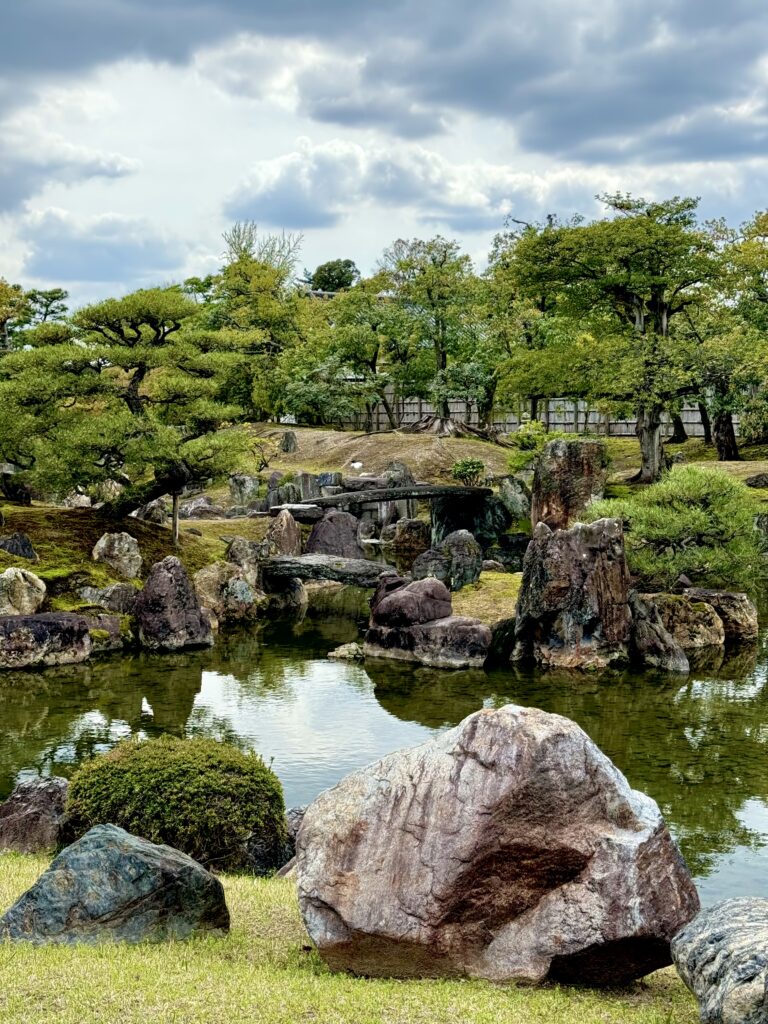View of Nijo Castle garden with rock bridges and stones.