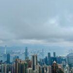 Birds eye-view of the Kowloon and Victoria Harbour skylines. Skyscrapers dot the skylines of Hong Kong.