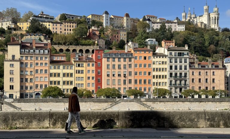 Man walking by the canals in Lyon.