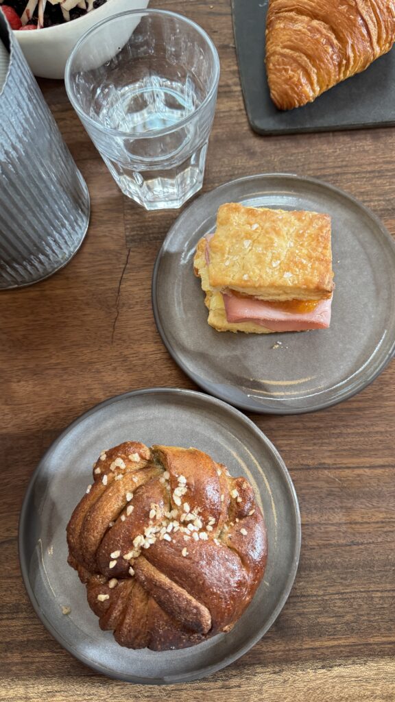 A scone sandwich with ham and cheese and a cardamum bun. A perfect snack for your long weekend in montreal.